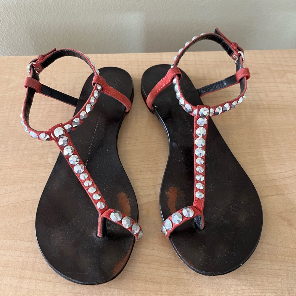 Giuseppe Zanotti Orange flat suede sandals with studs.